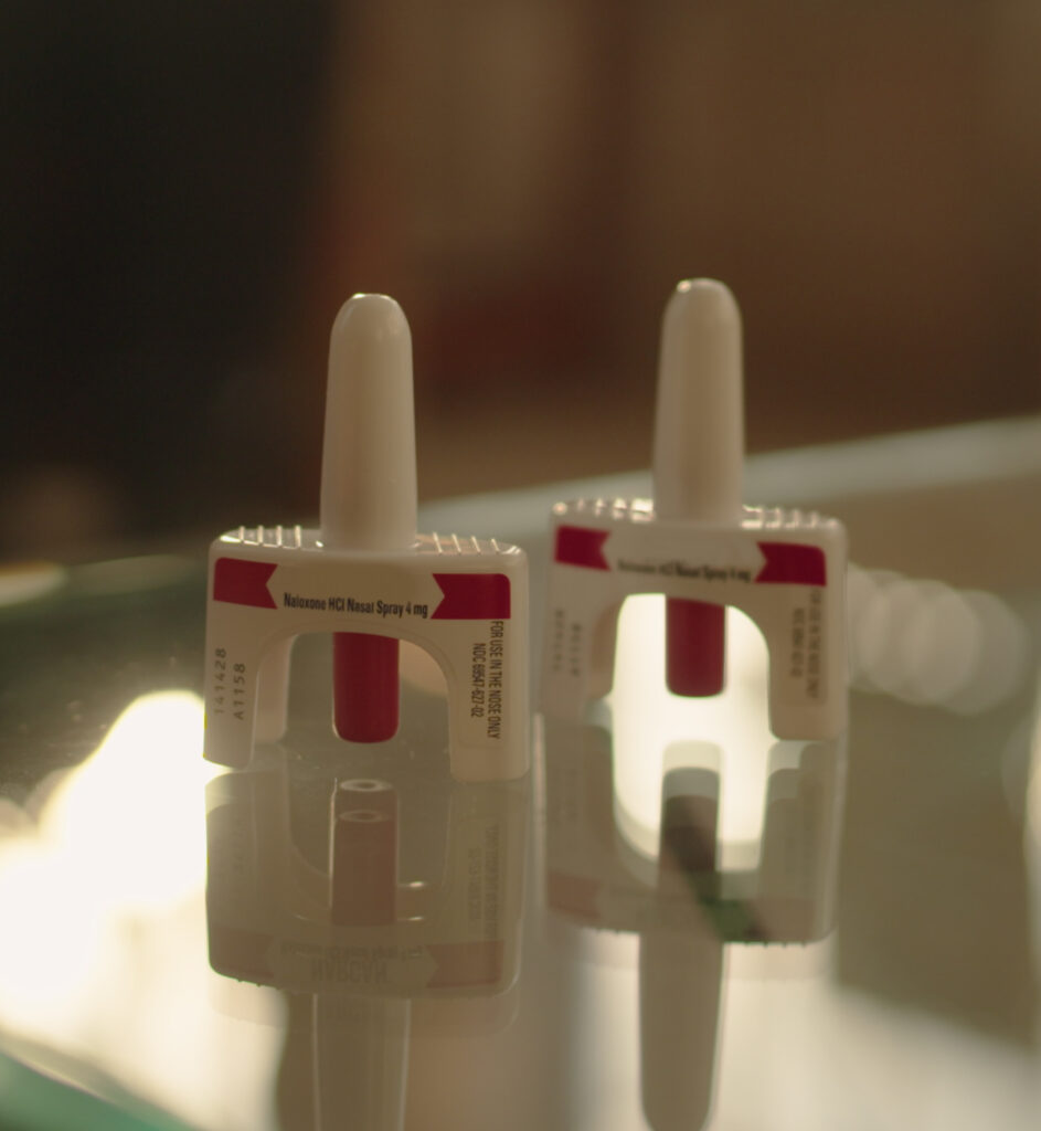 two naloxone inhalers on a table